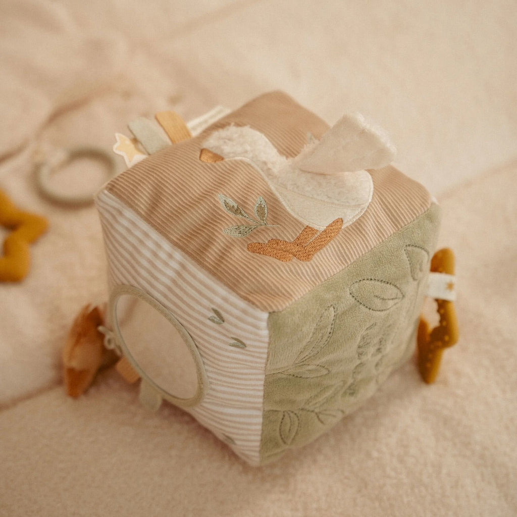 Little Dutch Activity Cube Newborn Naturals held in baby hands