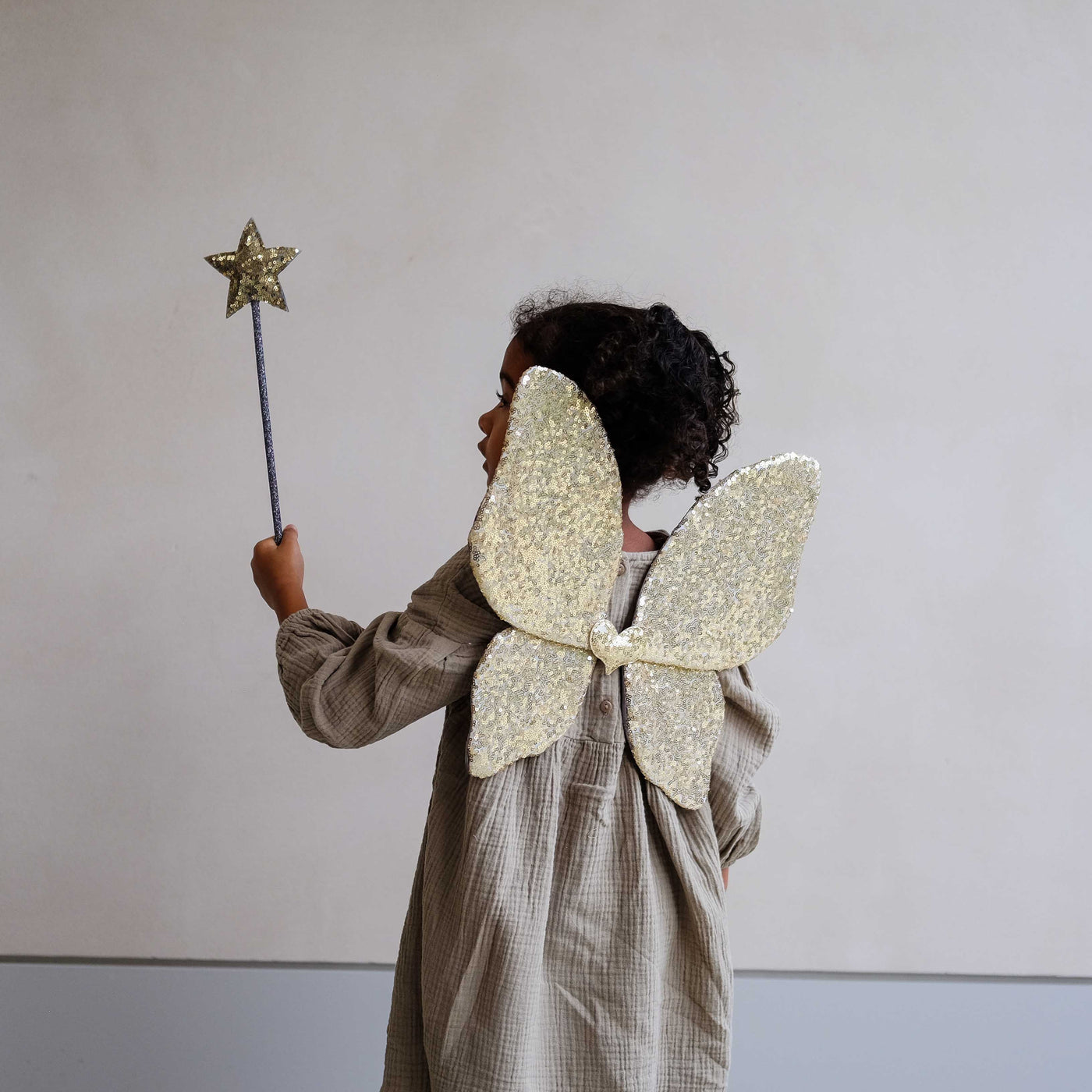 Mimi & Lula Sparkle Sequin Wings styled with gold sequin wand
