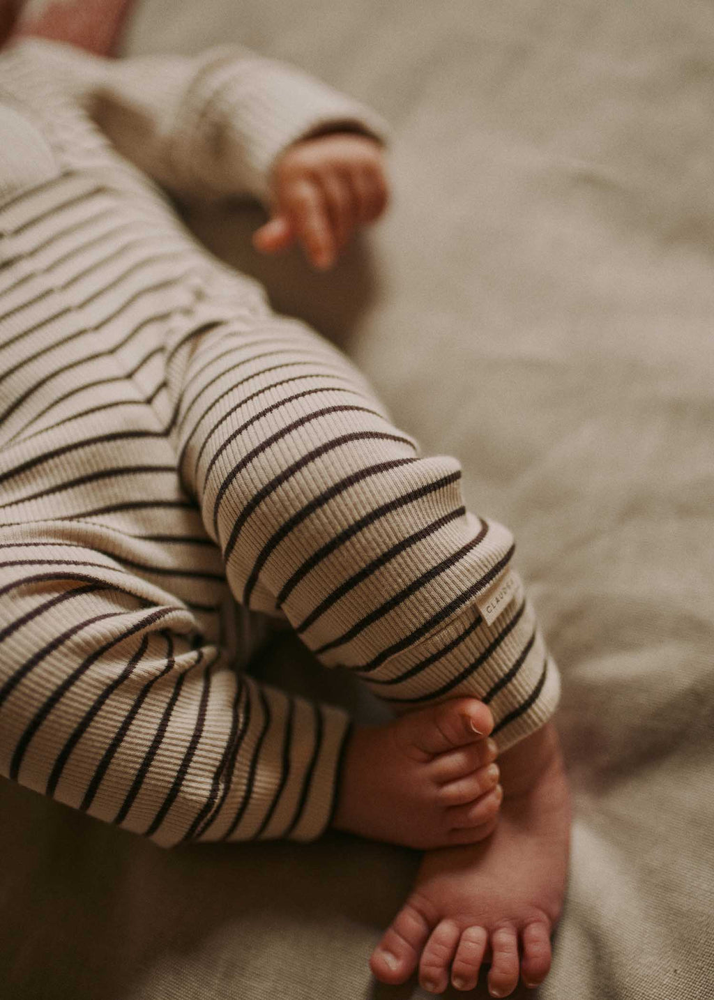 Baby wearing Claude & Co coco stripe leggings