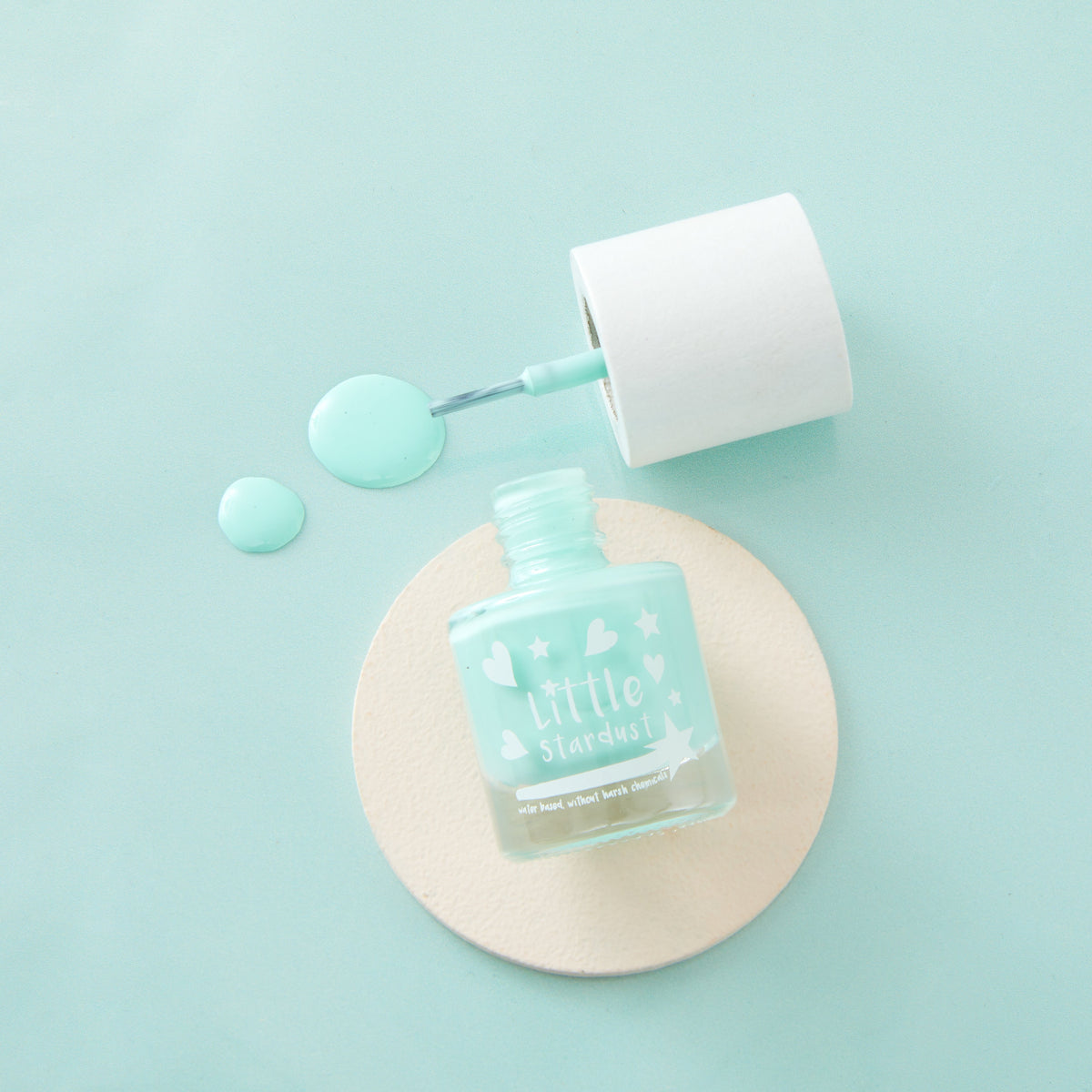 Little Stardust Aqua Space Mist turquoise water-based kids' nail polish in an 8ml glass bottle