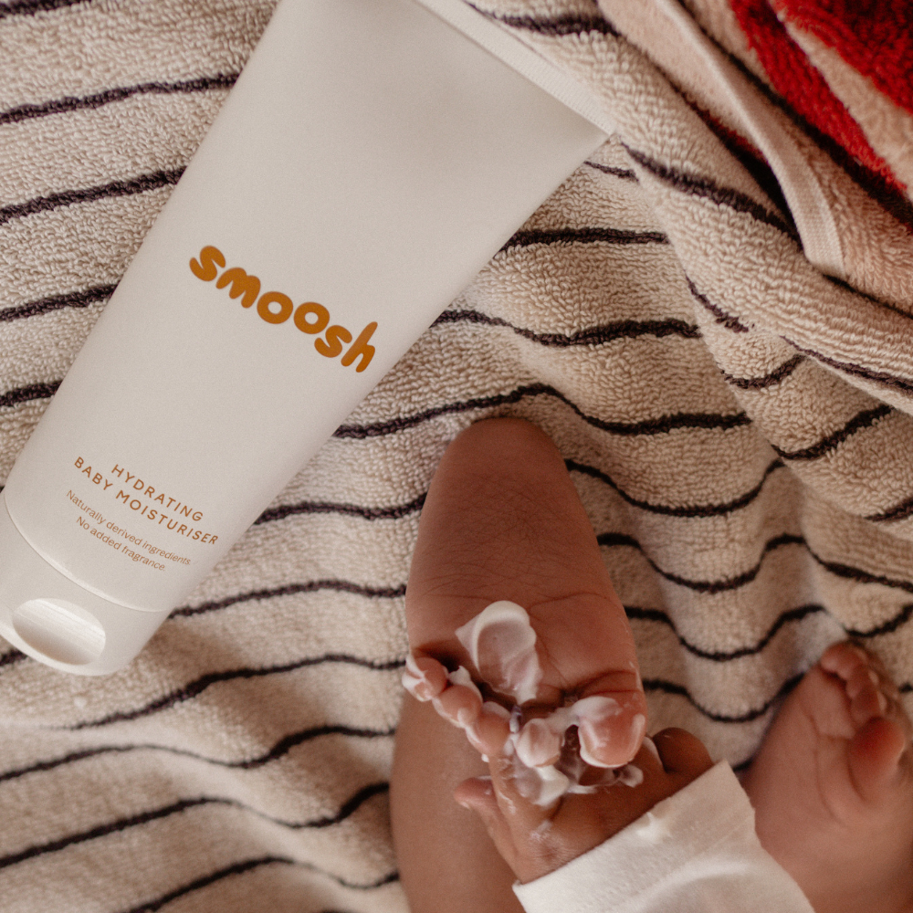 Smoosh hydrating baby moisturiser being applied to a baby