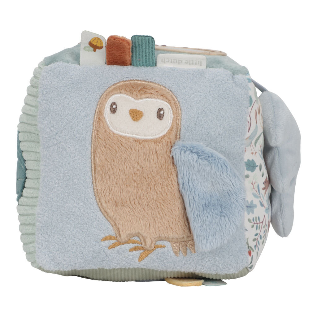 Little Dutch Forest Friends activity cube held in a baby's hands