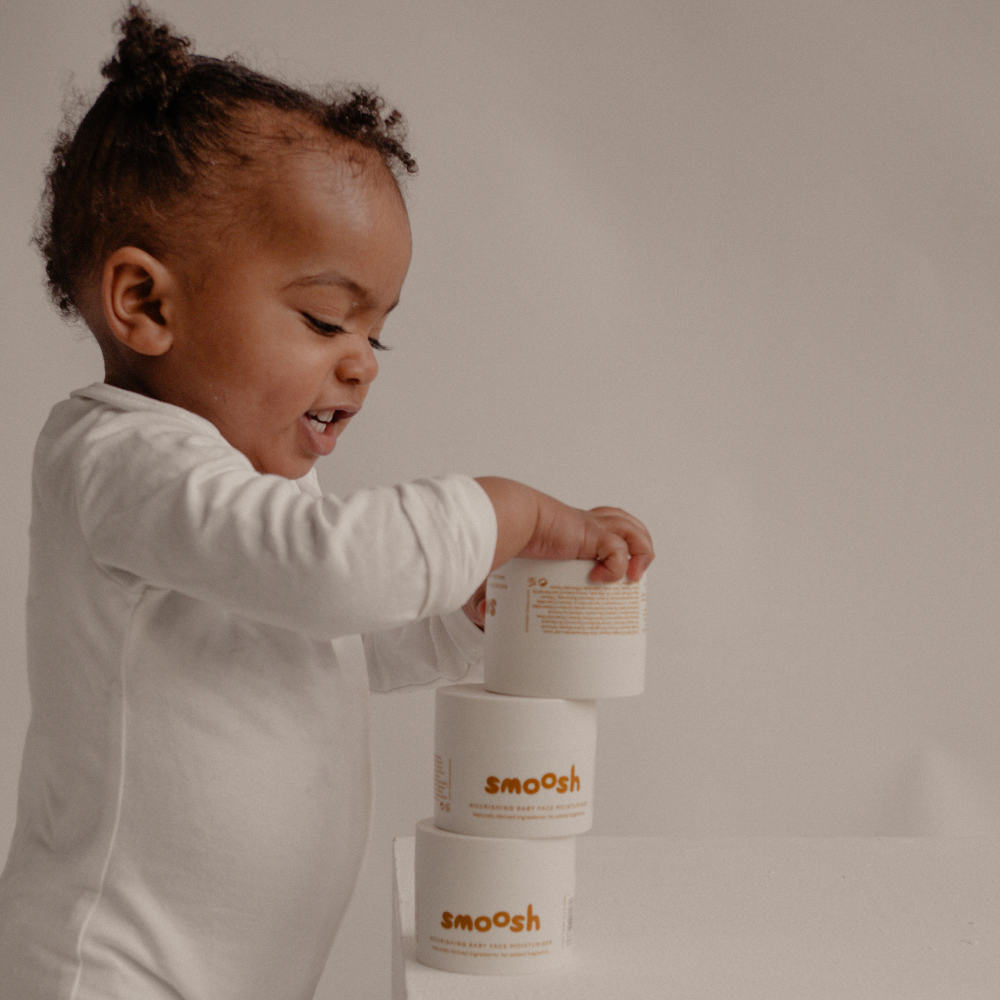 Stacked jars of Smoosh baby face moisturiser